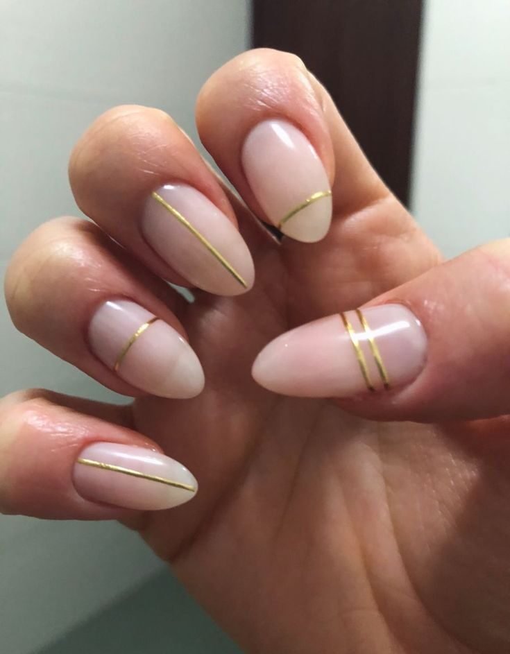 gold lines and milky pink nails